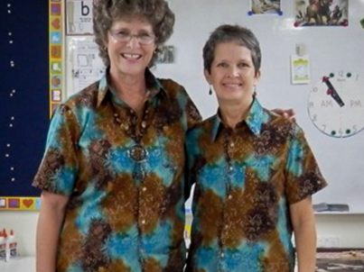 Wear cool matching uniforms with lively Indonesian prints. (Teachers Mary Epp, left, and Lynne Bontrager, right).