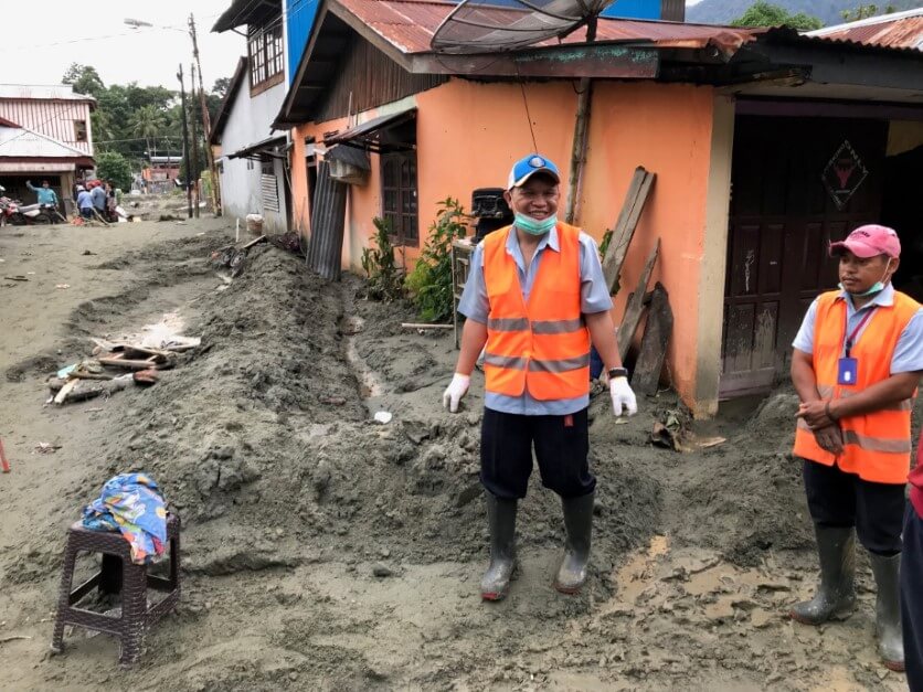 Mission Aviation Fellowship staff begin the arduous work of digging out after flooding and landslides in Sentani, Papua, Indonesia