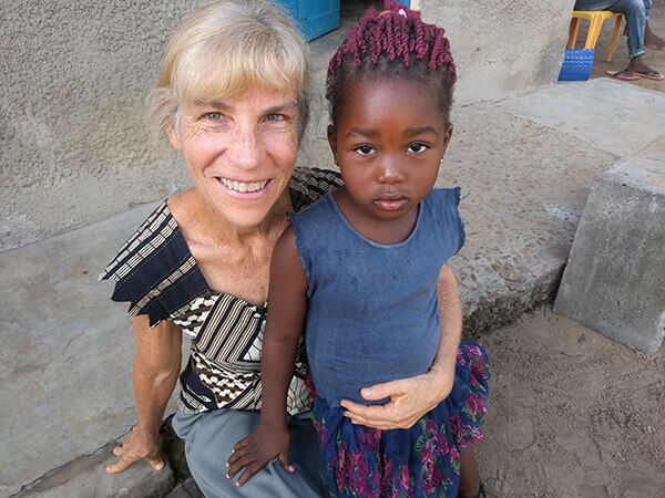 Katherine Niles poses with a sweet Congolese girl. Photo courtesy of Katherine Niles.